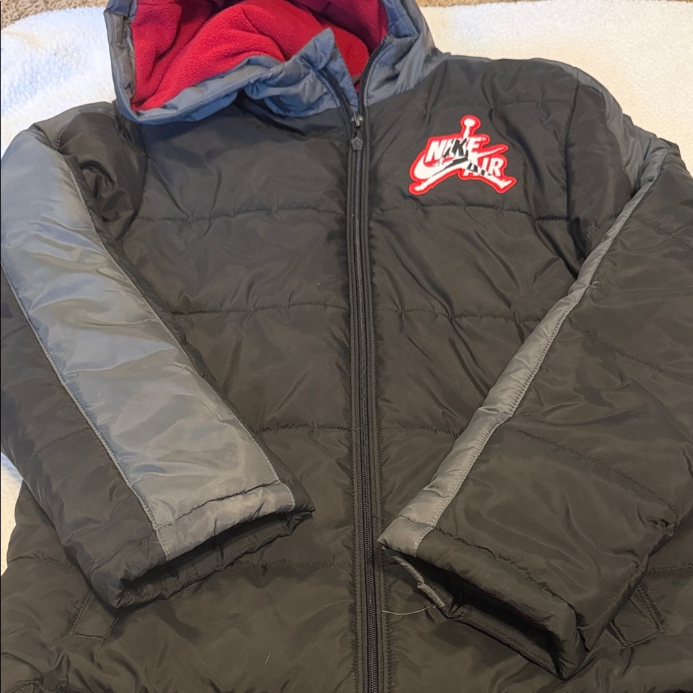 Nike Air Jordan Kids Black Puffer Jacket with Gray Sleeves and Red Lining